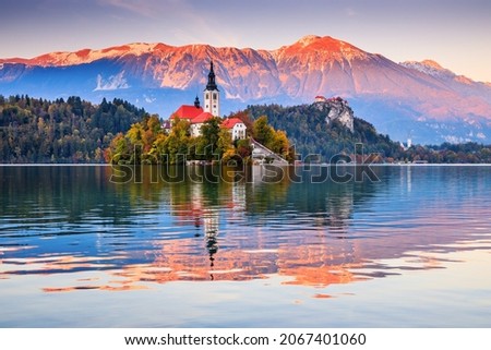 Lake Bled, Slovenia. Sunset at Lake Bled with famous Bled Island and historic Bled Castle in the background. Royalty-Free Stock Photo #2067401060