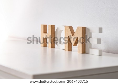 Wooden letters that form the word Home