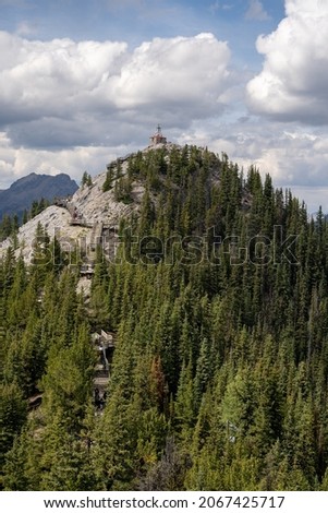 An aerial shot of the cosmic ray station of the sulphur mountain in Canada under cloudy sky