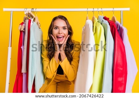 Photo of impressed beautiful lady wear suit jacket buying new clothes hands arms cheeks cheeknones isolated yellow color background
