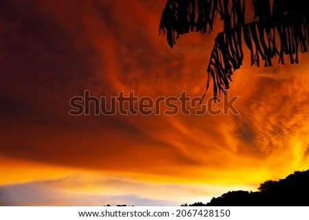 Picture of the evening sky, the light of the sun shining through the beautiful colorful clouds.