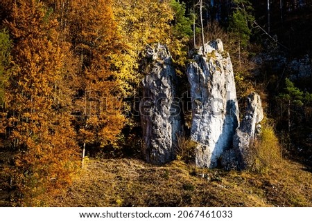 Rocky Formation - Father, mather and son in Moravian karst in the South Moravia, Czech republic. Autumn view.