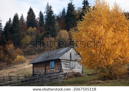beautiful mountains Ukrainian landscape. old wooden house on a background of mountains. Carpathians, Ukraine 
