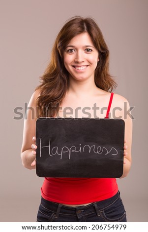 Young beautiful woman holding a small black board