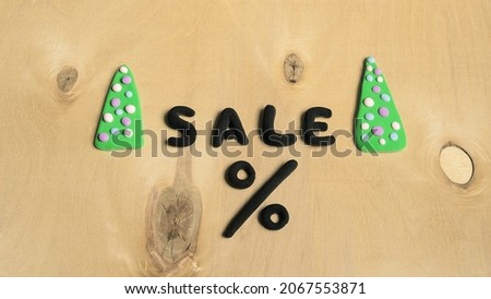 black letters made of plasticine on a wooden background , the concept of black Friday,Christmas sales and cyber Monday