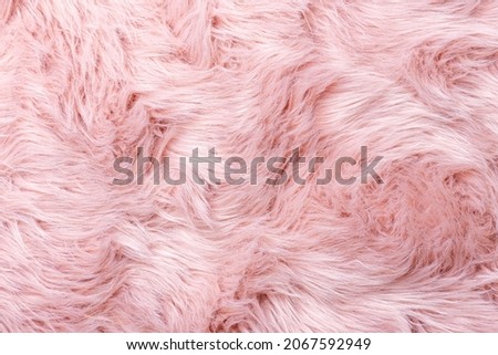 Pink fur texture top view. Pink sheepskin background. Fur pattern. Texture of pink shaggy fur. Wool texture. Sheep fur close up Royalty-Free Stock Photo #2067592949