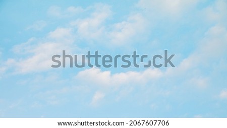 Soft Nature Sky Background Texture. Beautiful Light blue Sky in white clouds. Delicate Wide Wallpaper or Web banner for Design