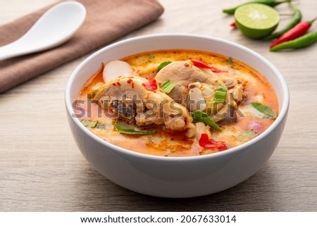 Tom yum Gai,Creamy spicy soup with Chicken,hot and sour taste,asian food Royalty-Free Stock Photo #2067633014