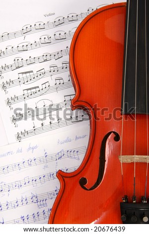 Violin on music book, background