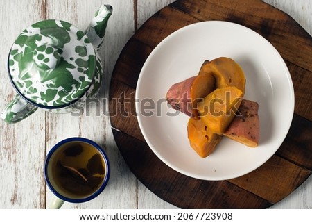 Steamed sweet potato, healthy snack for tea or coffee time and also brunch. Picture in top view or flatlay on wooden board and white background