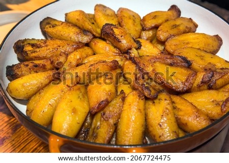 Fried plantains are served at a dinner buffet. 