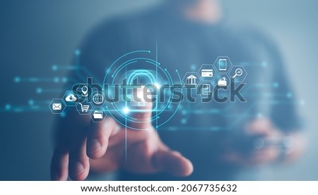 Cybersecurity and privacy concepts to protect data. Lock icon and internet network security technology. Businessman protecting personal data on smart phone with virtual screen interfaces. Royalty-Free Stock Photo #2067735632