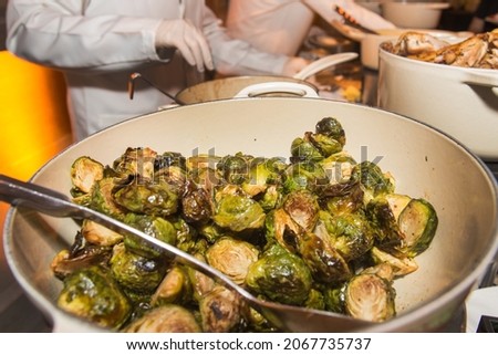 Brussels sprouts are served at a dinner buffet at an event. 