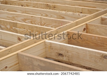 Floor joists made of heavy lumber on new construction Royalty-Free Stock Photo #2067742481