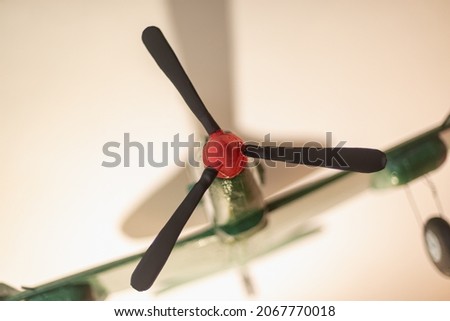 Homemade plane with a plasticine propeller. Royalty-Free Stock Photo #2067770018