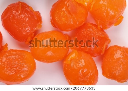 Round orange salted egg yolk cuisine cake ingredient on white background closeup macro