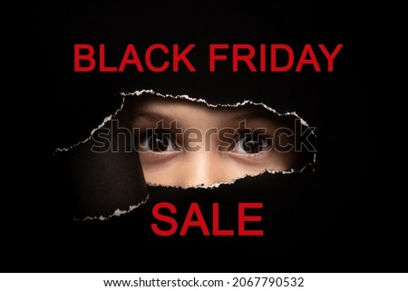 The child's eyes are close. Black Friday. Sale.