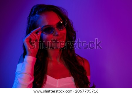 Photo of charming confident lady look cyberpunk future wear sunglass shirt isolated dark neon gradient color background