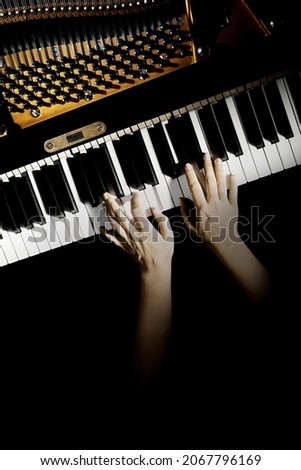 Piano player hands pianist playing keyboard. Musical instruments keys closeup