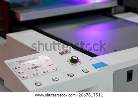 Control panel of UV flatbed printing machine. Selective focus.