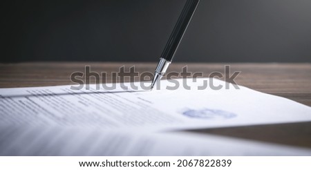 Pen signing in contract. Business Royalty-Free Stock Photo #2067822839