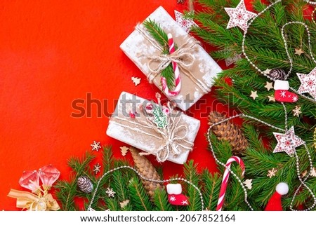 New Year's concept. Background for advertising or inscriptions made of fir branches and various Christmas decorations.