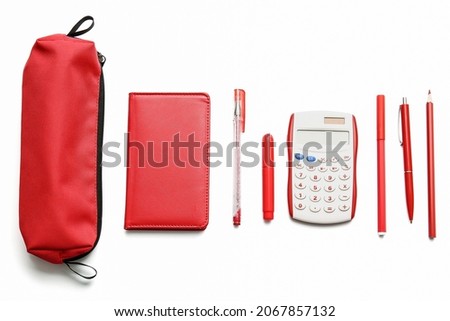 Pencil case with stationery on white background Royalty-Free Stock Photo #2067857132
