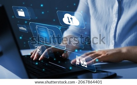  Enterprise resource planning(ERP) and management documentation concept. Businesswoman working on a laptop with virtual digital screen icons. Royalty-Free Stock Photo #2067864401