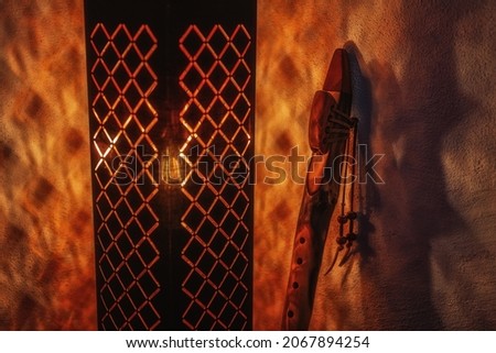 beautiful lamp and indian flute on a dark background.