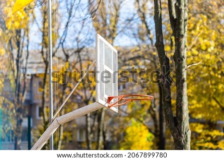 basketball hoop close-up on an autumn background.