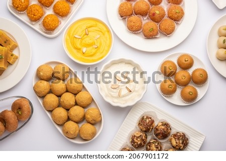 Group of Indian assorted sweets or mithai with diya Royalty-Free Stock Photo #2067901172