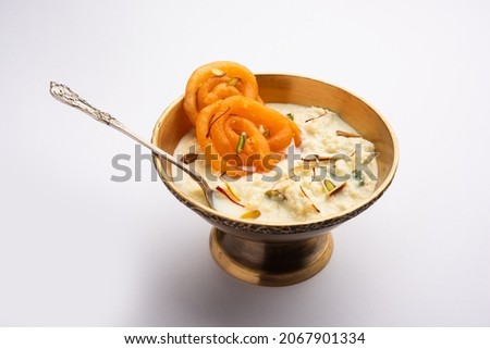 Rabri jalebi or imarati with rabdi made from condensing milk, famous dessert sweet from India Royalty-Free Stock Photo #2067901334