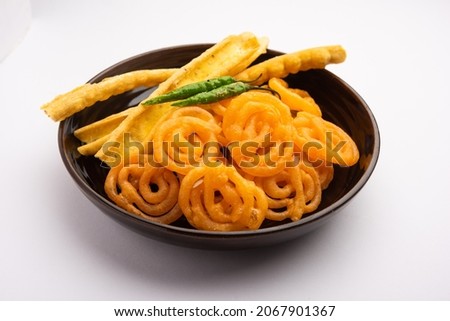 Crispy Fafda with sweet jalebi is an Indian snack most popular in Gujarat, selective focus Royalty-Free Stock Photo #2067901367