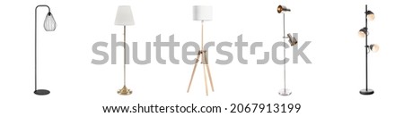 Stylish stand lamps on white background Royalty-Free Stock Photo #2067913199