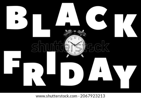 Time to buy. Black background with white letters Black Friday and an alarm clock in the center. High quality photo