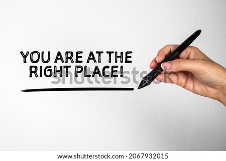 You are at the right place! Woman with pen writing on screen.