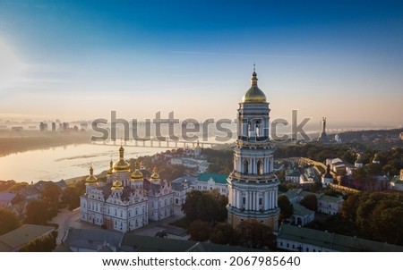 Beautiful aerial view of Pechersk Lavra in Kyiv at sunrise. A UNESCO world heritage site in Ukraine. View from drone. Space for text. The capital of Ukraine, before the war with Russia. 