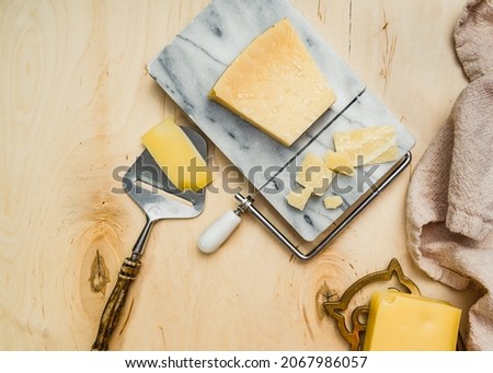 Cheese on marble plate light background 