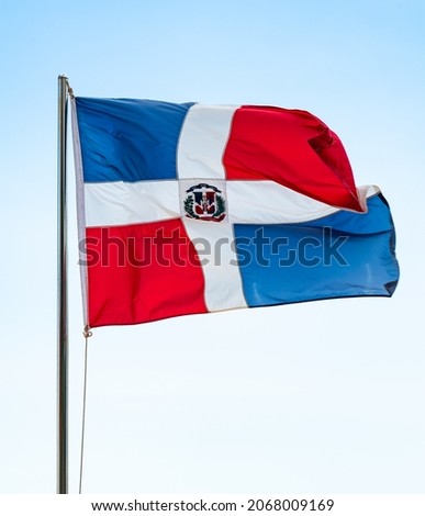 photography real flag of the Dominican Republic waving in the wind