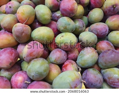 Tommy Atkins mango in a supermarket. Royalty-Free Stock Photo #2068016063