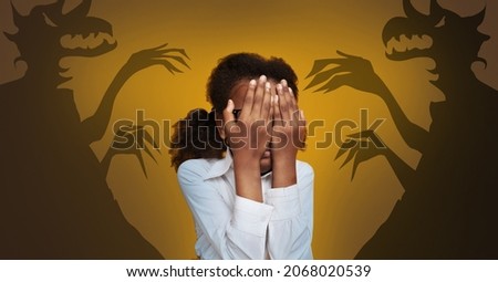 Phobias And Inner Fears Concept. Little Black Girl Afraiding Of Shadow Monsters Drawn Around Her Over Yellow Background, Terrified African American Teen Covering Face With Hands, Creative Collage