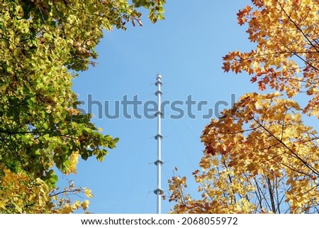 Obninsk meteorological mast in autumn against the blue sky. Obninsk, Russia