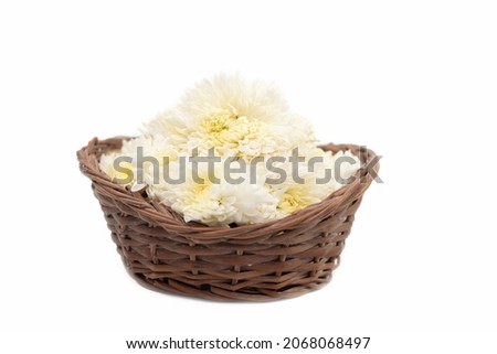 White Flowers In Bamboo Basket Called Puja Phool Ki Tokri Or Dalia For Decoration And Offering To Hindu God During Festivals viz. Shubh Deepawali, Dussehra, Navratri, Durga Pooja Etc.
