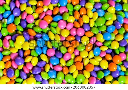 Assorted bright colorful Chocolate candys, Sugar Coated Chocolate Gems Candy. Royalty-Free Stock Photo #2068082357