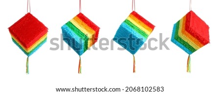 Set of Mexican pinata in shape of cube on white background