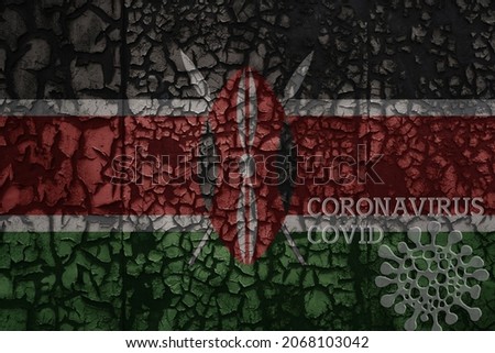 flag of kenya on a old vintage metal rusty cracked wall with text coronavirus, covid, and virus picture.