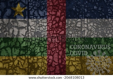 flag of central african republic on a old vintage metal rusty cracked wall with text coronavirus, covid, and virus picture.