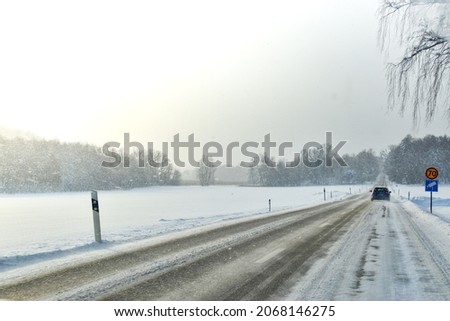 Driving on a winter road in Sweden, Scandinavian way of living, snow fall, cold, freezing weather, drive, speed limit, dangerous path, countryside, frozen surface, traffic, signs, lights, north, polar