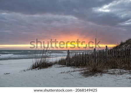 Sunset burst on ocean beach