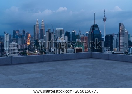 Panoramic Kuala Lumpur skyline view, concrete observatory deck on rooftop, night. Asian corporate and residential lifestyle. Financial city downtown, real estate. Product display mockup empty roof Royalty-Free Stock Photo #2068150775